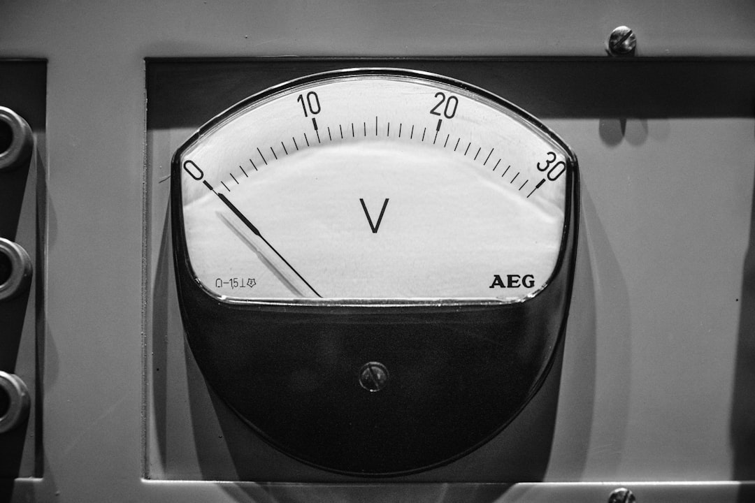 A close-up of an analog voltmeter displaying zero volts, with a scale from 0 to 30 volts—perfect for monitoring voltage control during accelerated stability testing in pharmaceutical stability studies.
